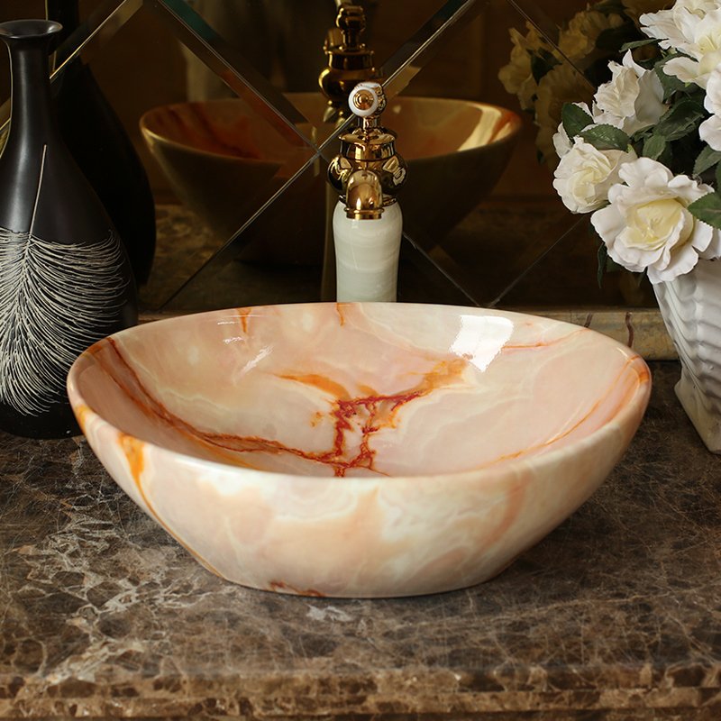 Elevate your bathroom or balcony with the Elegant Blue Ceramic Basin, designed to bring a touch of luxury and modern Nordic style to your home. With its glossy metal glaze finish and serene blue hue, this basin offers both beauty and practicality. Crafted from high-quality ceramic, it features an oval shape with a generous 12-liter capacity, making it perfect for a stylish and functional wash area. Ideal for both indoor and outdoor use, this versatile basin is easy to clean and maintain, ensuring long-lasting elegance in any setting.