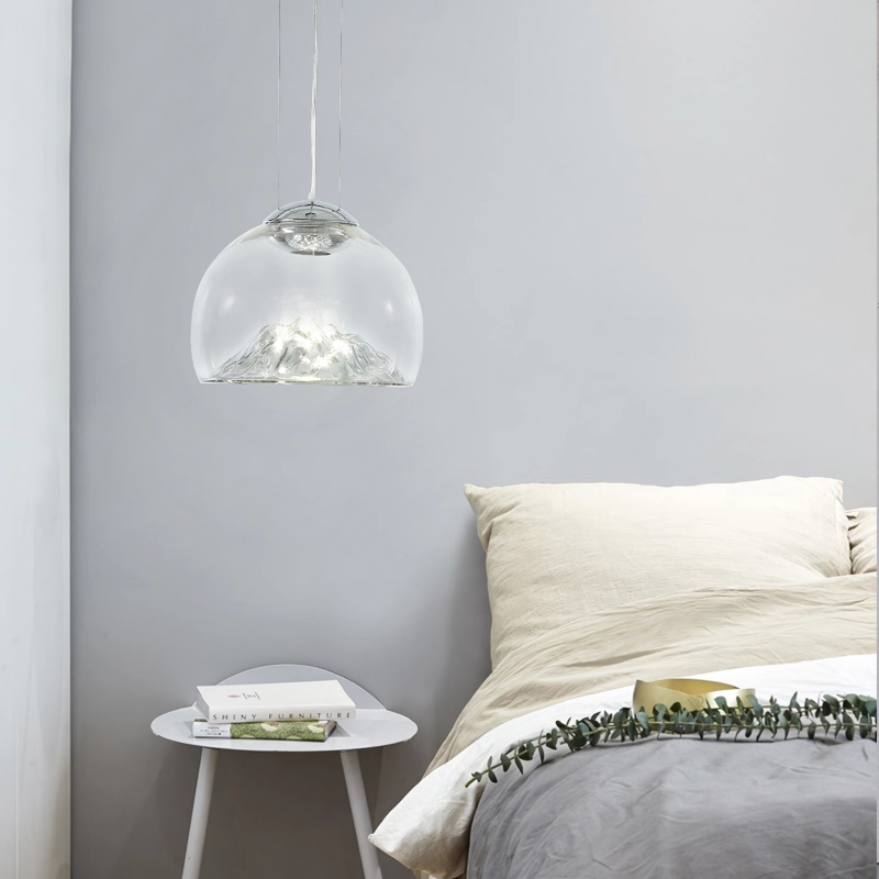 Transform your space with the Modern Electroplated Glass Pendant Lamp, a sophisticated lighting solution that blends contemporary design with artistic flair. Featuring a sleek, electroplated golden glass finish and a unique Nordic mountain-inspired design, this lamp adds a touch of elegance to any room. Crafted from high-quality glass and iron, it provides durable, energy-efficient lighting with included LED bulbs. The adjustable steel cables allow for customizable height, making it perfect for dining areas, living rooms, bedrooms, restaurants, hotels, or offices. Available in clear and golden or clear and silver finishes, this pendant lamp enhances any interior with style and functionality. Elevate your decor today!