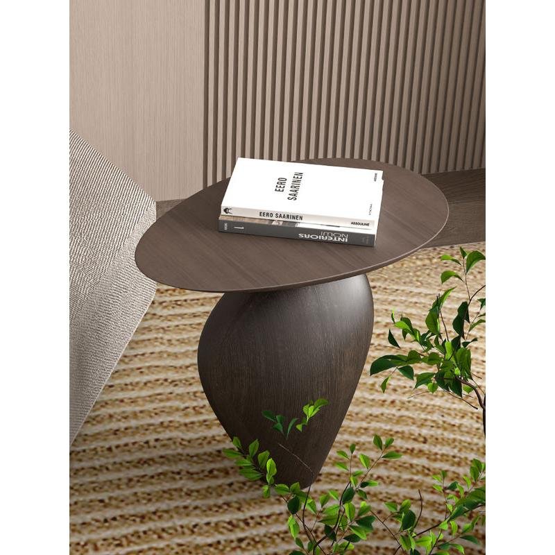 Bring modern elegance to your home with the Nordic Creative Cobblestone Side Table. Crafted from high-quality resin, this handmade piece mimics the natural beauty of cobblestones, adding a unique and artistic touch to your space. Its versatile design fits perfectly in living rooms, studies, or bedrooms, offering both style and functionality. Available in black or walnut, this table is a standout with its minimalist, Nordic-inspired look. Each handcrafted piece ensures no two are alike, making it a distinctive addition to your decor. Perfect as a decorative accent or a thoughtful gift, this side table brings both charm and durability to any room.