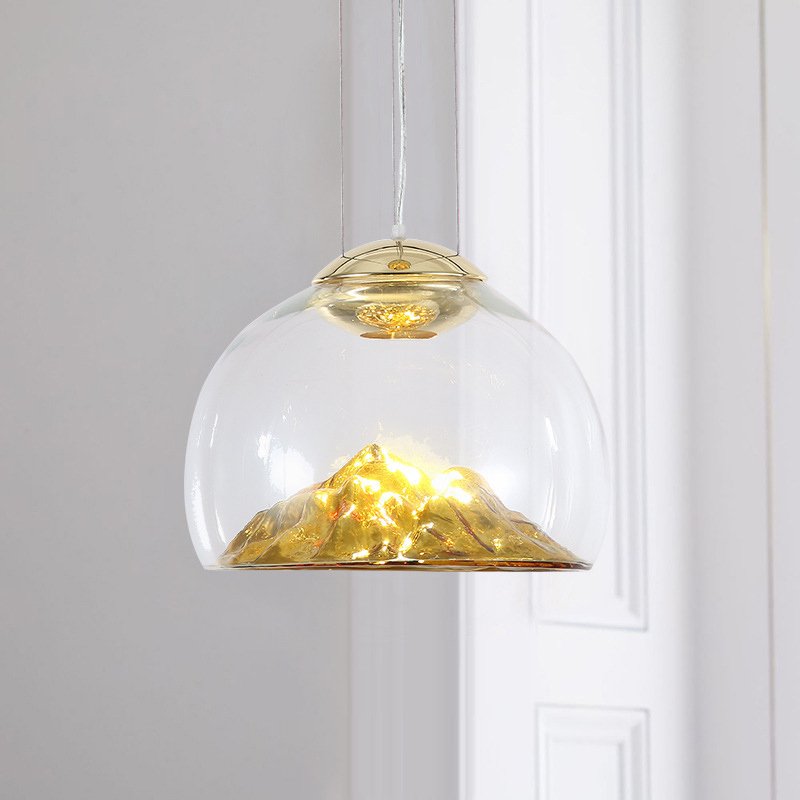 Transform your space with the Modern Electroplated Glass Pendant Lamp, a sophisticated lighting solution that blends contemporary design with artistic flair. Featuring a sleek, electroplated golden glass finish and a unique Nordic mountain-inspired design, this lamp adds a touch of elegance to any room. Crafted from high-quality glass and iron, it provides durable, energy-efficient lighting with included LED bulbs. The adjustable steel cables allow for customizable height, making it perfect for dining areas, living rooms, bedrooms, restaurants, hotels, or offices. Available in clear and golden or clear and silver finishes, this pendant lamp enhances any interior with style and functionality. Elevate your decor today!