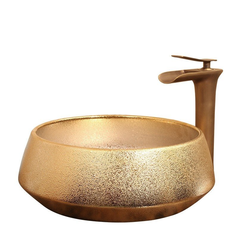Elevate your bathroom with our Luxury Gold Glazed Ceramic Bathroom Basin, a stunning hand-made vessel sink that exudes elegance and sophistication. Featuring a luxurious gold glaze finish and unique oval shape, this high-quality ceramic basin is designed to add a touch of opulence to any bathroom. Its durable, easy-to-clean surface ensures lasting beauty, while its versatile design complements both contemporary and traditional decor styles. Make a statement with this exquisite bathroom upgrade—order yours today and transform your space into a luxurious retreat.