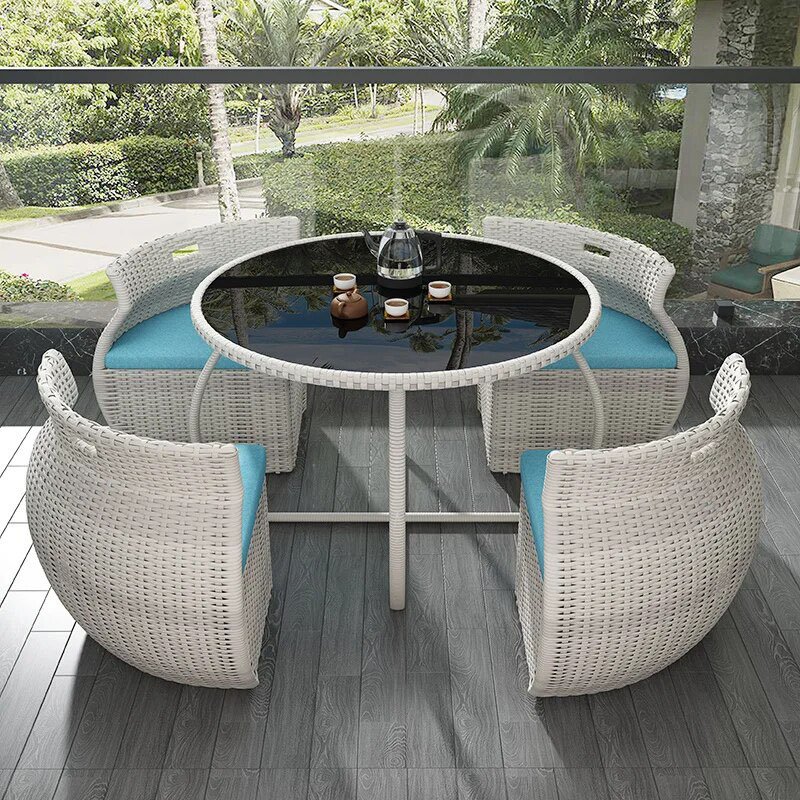 Transform your outdoor space with the Elegant Modern Outdoor Rattan Furniture Set. This chic and durable three-piece set, featuring a sleek dining table and two matching chairs, adds a touch of sophistication to any garden, balcony, or patio. Crafted from high-quality rattan, it's built to withstand the elements while providing maximum comfort and style. Perfect for dining or relaxing, this set enhances your outdoor experience with its minimalist design and weather-resistant materials. Create your own outdoor haven today!