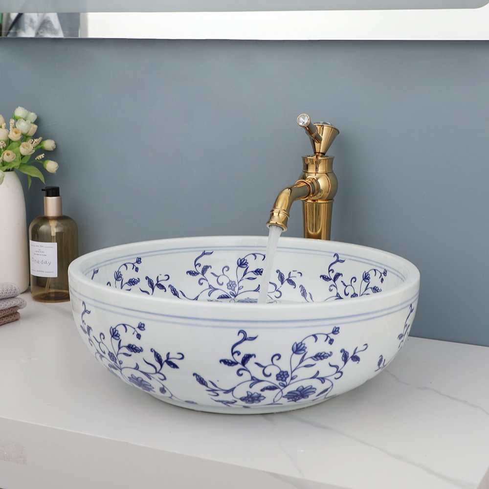 Transform your bathroom or kitchen with the timeless beauty of our Hand-Painted Ceramic Basin Sink. Featuring a traditional Chinese blue and white floral design, this exquisite sink adds sophistication and charm to any space. Crafted from high-quality ceramic and fired at 1300 degrees, this durable and easy-to-clean sink will remain a striking centerpiece in your home for years to come.