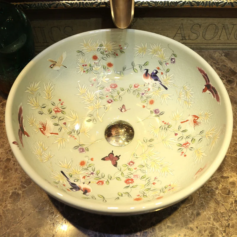 4906818669bfe61686241a7cd33fedc6 Transform your bathroom with the Elegant Round Ceramic Bathroom Sink, designed to elevate both the look and functionality of your space. Crafted from high-quality ceramic, this sink offers durability, a glossy finish, and a 9-liter capacity, providing ample space for everyday use. Its sleek round shape complements both modern and traditional bathroom styles, making it a versatile addition to any vanity. With a 4