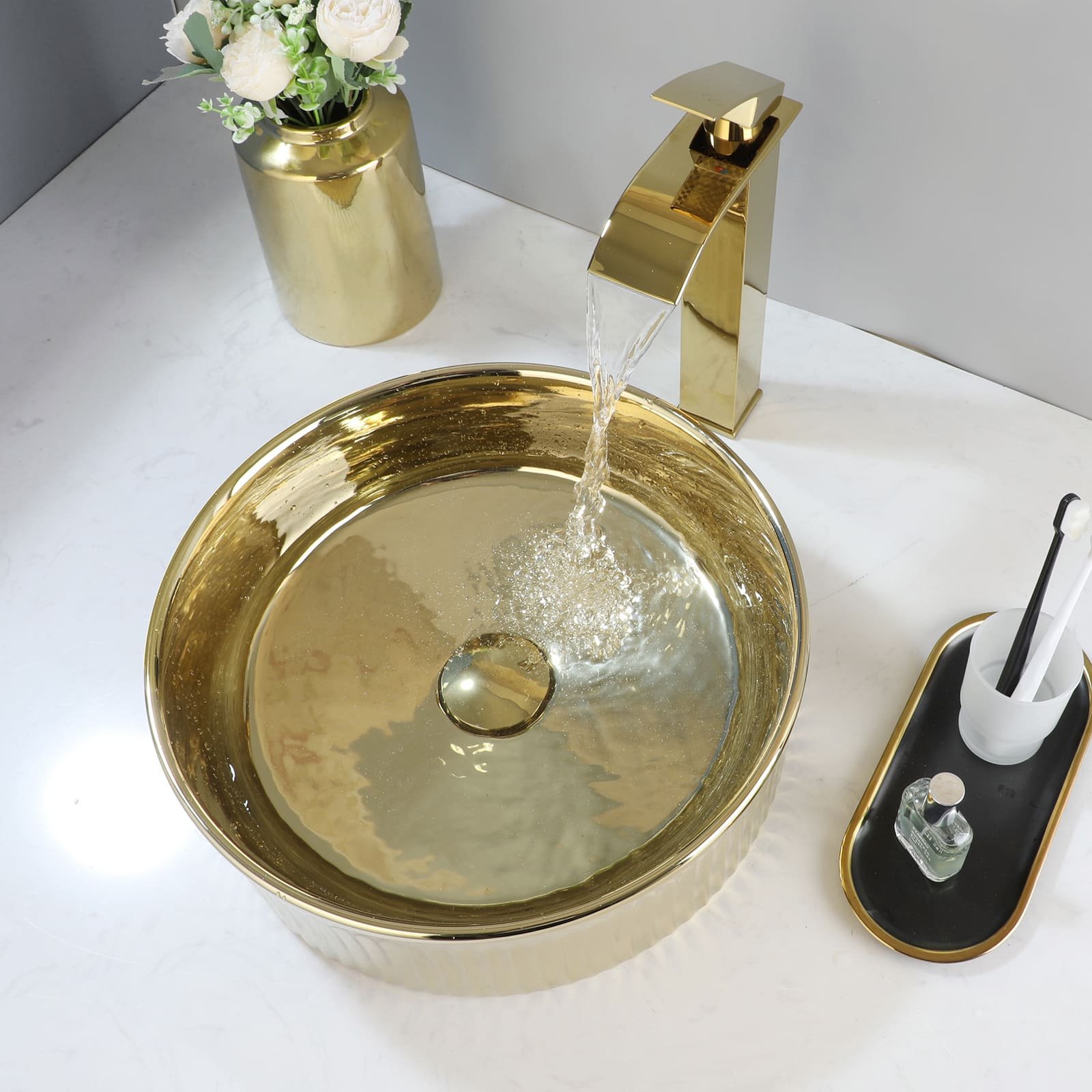 672e8e81131579083c6de811506f4173.jpg-full Transform your bathroom into a luxurious retreat with our Luxury Gold Round Ceramic Vessel Sink and Faucet Combo. Featuring a traditional Chinese hand-painted blue and white floral design, this above-counter sink combines artistry with functionality. Crafted from high-quality ceramic and fired at 1300°C, each sink is a durable masterpiece, designed to withstand everyday use while maintaining its beauty. The gold-polished faucet perfectly complements the elegant design, making it an ideal choice for those seeking sophistication and style.