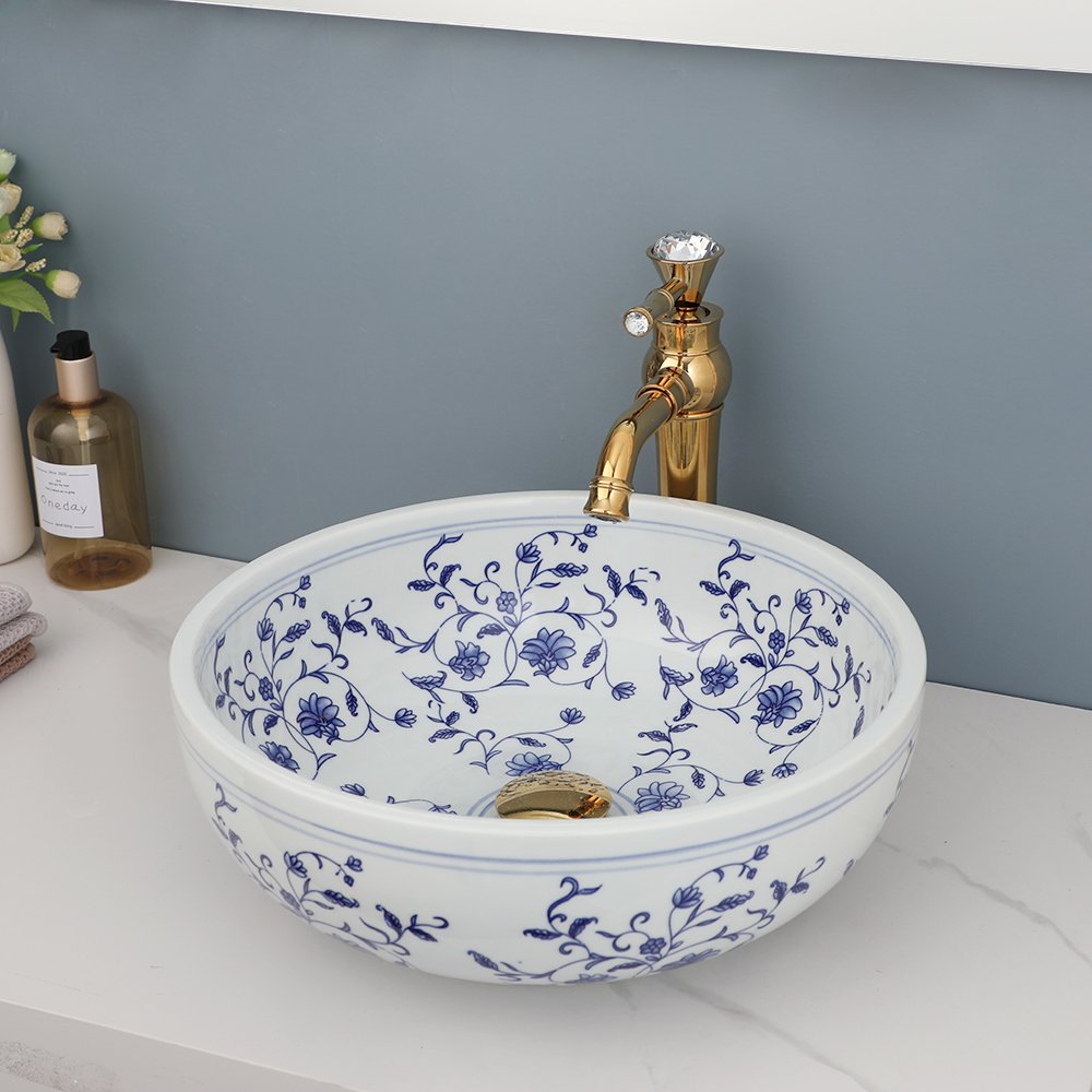 Transform your bathroom or kitchen with the timeless beauty of our Hand-Painted Ceramic Basin Sink. Featuring a traditional Chinese blue and white floral design, this exquisite sink adds sophistication and charm to any space. Crafted from high-quality ceramic and fired at 1300 degrees, this durable and easy-to-clean sink will remain a striking centerpiece in your home for years to come.