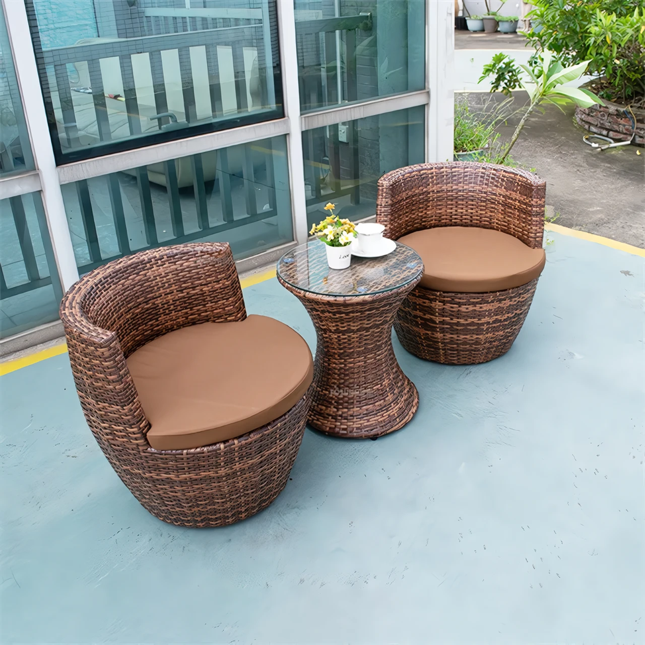 Elevate your outdoor space with the Modern Outdoor Rattan Patio Set. This stylish and durable furniture set, featuring a table and chairs, is crafted from high-quality rattan and wicker, ensuring both comfort and long-lasting performance. Weather-resistant and UV-protected, it's perfect for gardens, patios, or balconies, offering a modern minimalist design that seamlessly complements any decor. Ideal for relaxing afternoons, morning coffee, or entertaining guests, this set combines elegance and practicality to enhance your outdoor living experience.
