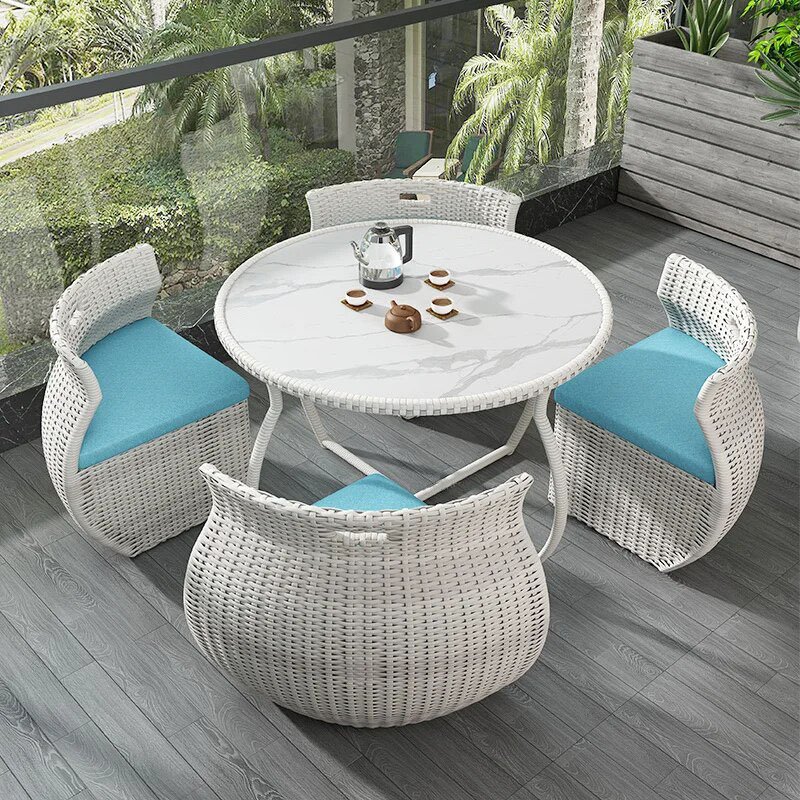 Transform your outdoor space with the Elegant Modern Outdoor Rattan Furniture Set. This chic and durable three-piece set, featuring a sleek dining table and two matching chairs, adds a touch of sophistication to any garden, balcony, or patio. Crafted from high-quality rattan, it's built to withstand the elements while providing maximum comfort and style. Perfect for dining or relaxing, this set enhances your outdoor experience with its minimalist design and weather-resistant materials. Create your own outdoor haven today!