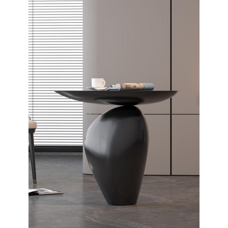 Bring modern elegance to your home with the Nordic Creative Cobblestone Side Table. Crafted from high-quality resin, this handmade piece mimics the natural beauty of cobblestones, adding a unique and artistic touch to your space. Its versatile design fits perfectly in living rooms, studies, or bedrooms, offering both style and functionality. Available in black or walnut, this table is a standout with its minimalist, Nordic-inspired look. Each handcrafted piece ensures no two are alike, making it a distinctive addition to your decor. Perfect as a decorative accent or a thoughtful gift, this side table brings both charm and durability to any room.