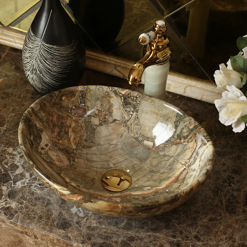 Elevate your bathroom or balcony with the Elegant Blue Ceramic Basin, designed to bring a touch of luxury and modern Nordic style to your home. With its glossy metal glaze finish and serene blue hue, this basin offers both beauty and practicality. Crafted from high-quality ceramic, it features an oval shape with a generous 12-liter capacity, making it perfect for a stylish and functional wash area. Ideal for both indoor and outdoor use, this versatile basin is easy to clean and maintain, ensuring long-lasting elegance in any setting.