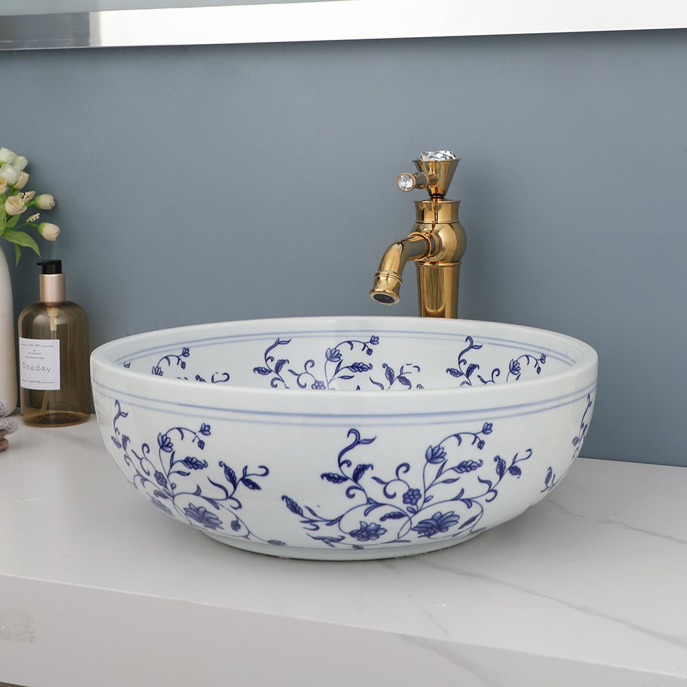 Transform your bathroom or kitchen with the timeless beauty of our Hand-Painted Ceramic Basin Sink. Featuring a traditional Chinese blue and white floral design, this exquisite sink adds sophistication and charm to any space. Crafted from high-quality ceramic and fired at 1300 degrees, this durable and easy-to-clean sink will remain a striking centerpiece in your home for years to come.
