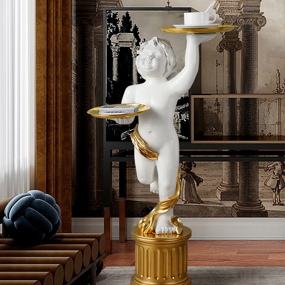 ee6e28f05106691e2d00b5082c135efb.jpg-full The European Style Cupid Angel Resin Statue is a perfect blend of elegance and practicality, bringing a touch of divine beauty to any room. Hand-carved from eco-friendly resin, this stunning statue features exquisite detail and is paired with a LINGAR metal tray for convenient storage of small items like keys, remote controls, or decorative pieces. The Roman column base adds both stability and artistic flair, making it an eye-catching accent in living rooms, bedrooms, or hallways. Available in white, gold, or vintage white, this versatile piece is ideal for homes or offices, offering both charm and functionality. Add this enchanting sculpture to your decor and enjoy its timeless beauty every day.