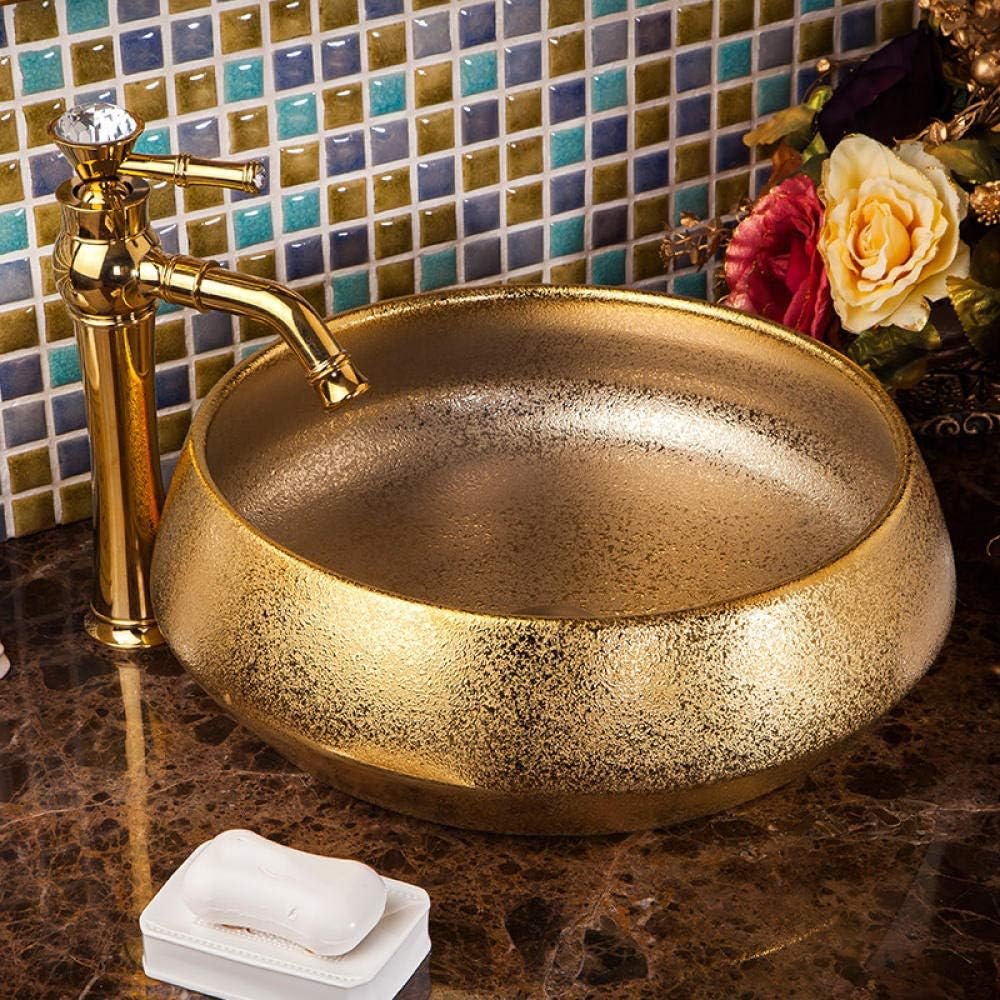Elevate your bathroom with our Luxury Gold Glazed Ceramic Bathroom Basin, a stunning hand-made vessel sink that exudes elegance and sophistication. Featuring a luxurious gold glaze finish and unique oval shape, this high-quality ceramic basin is designed to add a touch of opulence to any bathroom. Its durable, easy-to-clean surface ensures lasting beauty, while its versatile design complements both contemporary and traditional decor styles. Make a statement with this exquisite bathroom upgrade—order yours today and transform your space into a luxurious retreat.