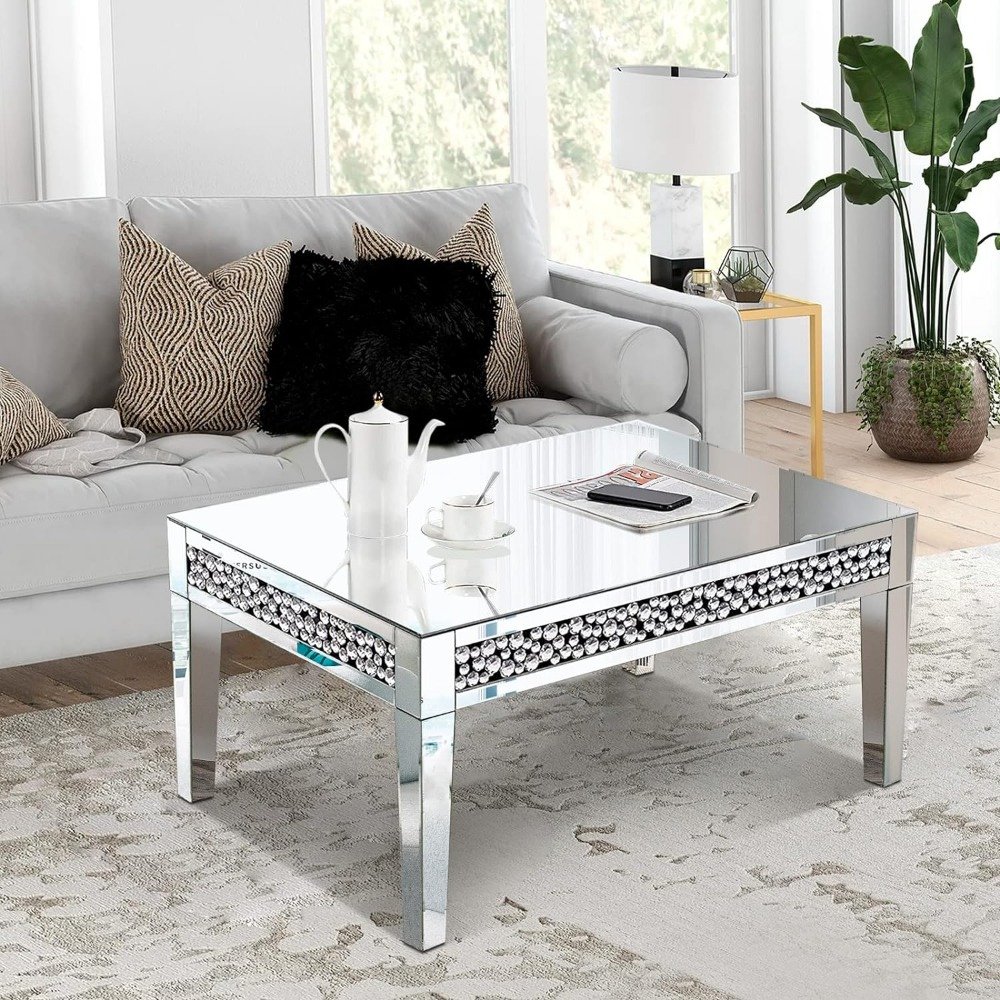 Elevate your space with the Luxury Rectangular Mirror Coffee Table, a stunning blend of modern sophistication and minimalist design. Crafted with high-quality silver mirror glass and adorned with crystal diamond inlays, this table reflects light, brightening any room while adding a touch of glamour. Its durable MDF frame ensures longevity, and the easy assembly process makes it a hassle-free addition to your home or office. Perfect for modern interiors, this table combines functionality with luxurious style, making it an ideal centerpiece for any living room, office, or boutique.