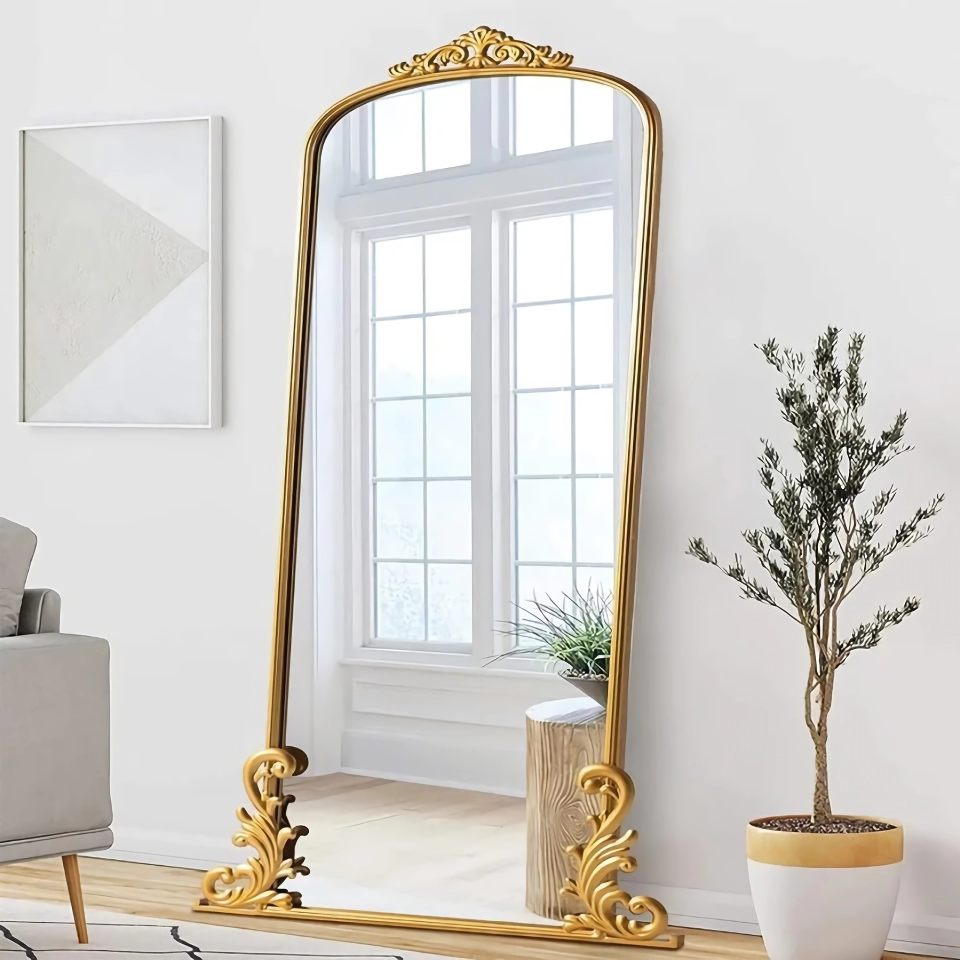 07f1be8e117eb0456085b8445b26131e Elevate your home with the Vintage Arched Full-Length Mirror, a perfect blend of timeless elegance and functional design. Featuring a beautifully carved metal frame in a luxurious gold finish, this mirror adds a touch of traditional glamour and farmhouse charm to any room. At 68
