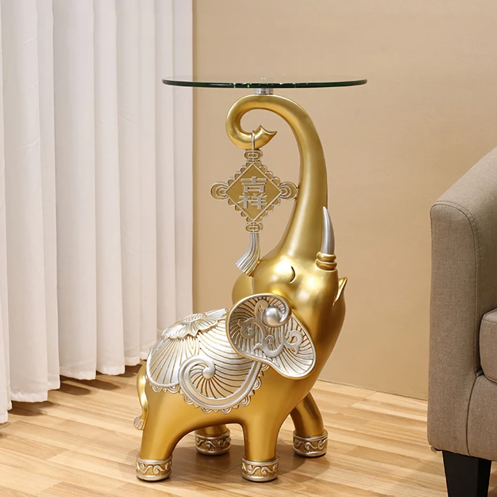 3608392d937aa5f86d3adcb7431fb04f The Resin Elephant Glass Top Coffee Table is a stunning fusion of art and functionality, designed to be the centerpiece of any room. Featuring a lifelike elephant base crafted from premium resin and topped with durable tempered glass, this table adds a touch of elegance and creativity to your space. Available in two sizes, it serves as both a functional coffee table and a stylish storage solution. Perfect for living rooms, commercial spaces, or eclectic décor themes, this semi-handmade table is not just furniture—it's a conversation starter and a true work of art. Elevate your space with this unique and captivating piece!