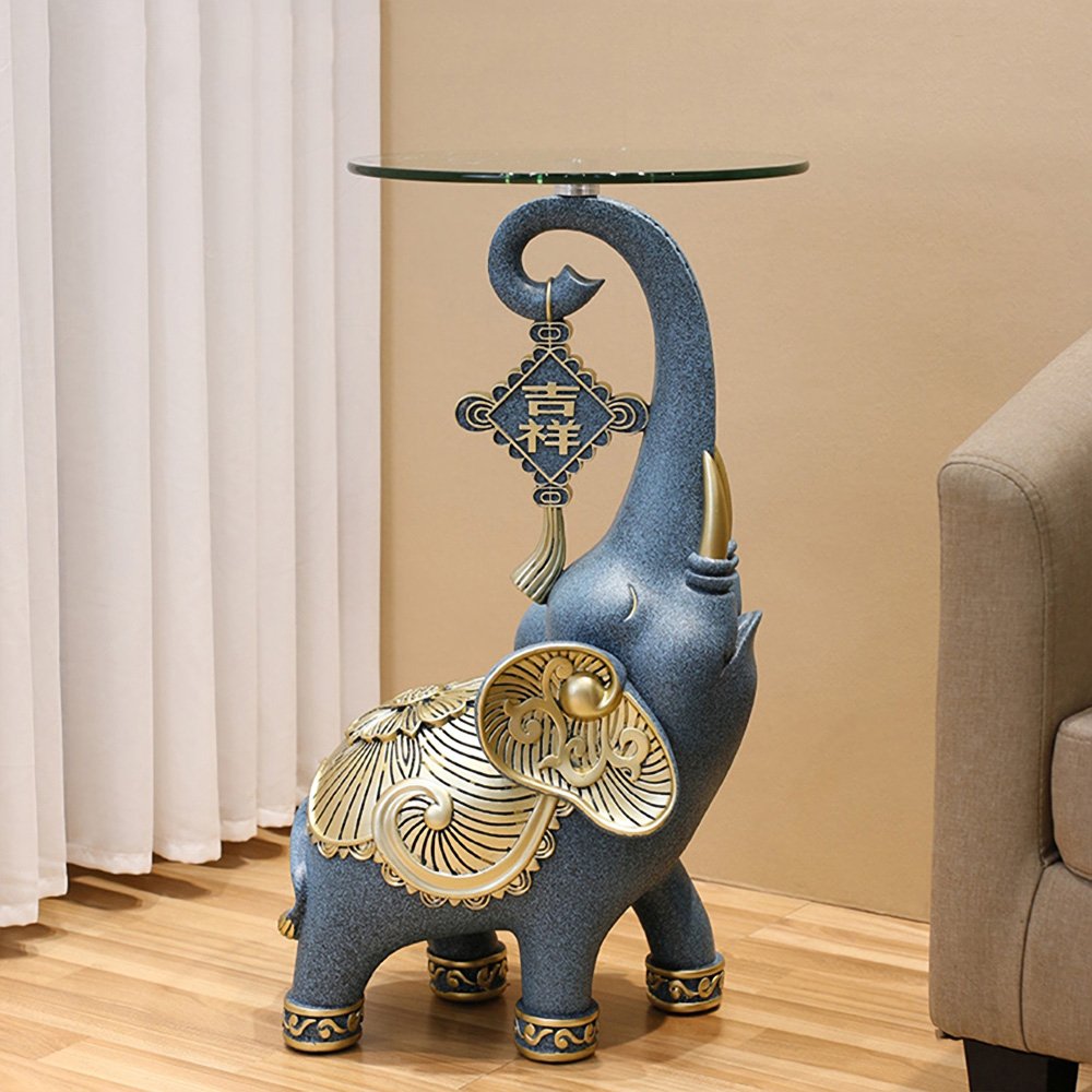 5a02aabc5b3b05fbca860d933944c288.jpg-full The Resin Elephant Glass Top Coffee Table is a stunning fusion of art and functionality, designed to be the centerpiece of any room. Featuring a lifelike elephant base crafted from premium resin and topped with durable tempered glass, this table adds a touch of elegance and creativity to your space. Available in two sizes, it serves as both a functional coffee table and a stylish storage solution. Perfect for living rooms, commercial spaces, or eclectic décor themes, this semi-handmade table is not just furniture—it's a conversation starter and a true work of art. Elevate your space with this unique and captivating piece!