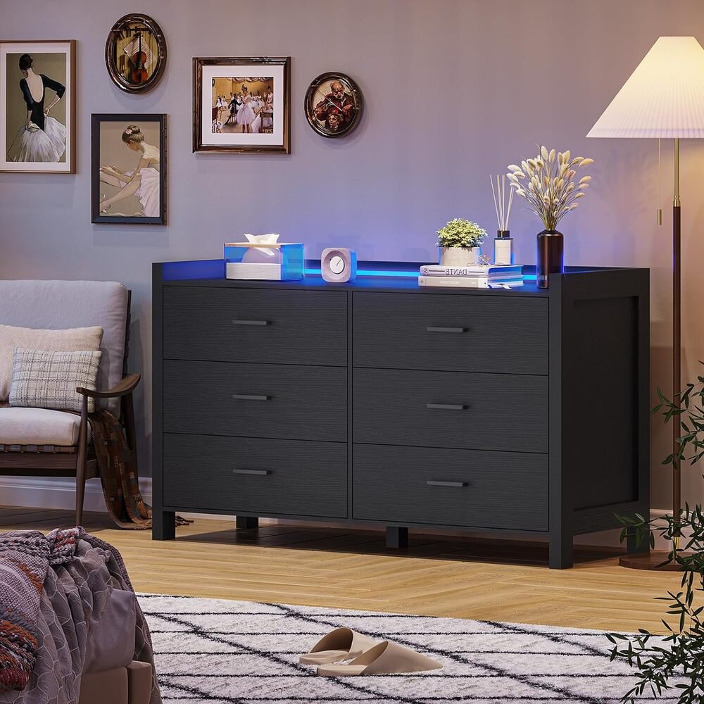 Elevate your space with the Modern LED 6-Drawer Dresser, where style meets smart functionality. This sleek black dresser features customizable LED lighting with over 60,000 color options and dynamic effects, all controlled via app or remote. Crafted from high-quality engineered wood, it offers durability and ample storage with six spacious drawers and a large tabletop. Perfect for bedrooms, living rooms, or nurseries, its modern design enhances any room while keeping your space organized. With easy installation and safety features, this dresser transforms both your décor and daily routine.
