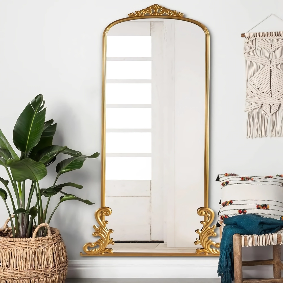 9bc1c1f5ed937150302c5fa4ec4b1087 Elevate your home with the Vintage Arched Full-Length Mirror, a perfect blend of timeless elegance and functional design. Featuring a beautifully carved metal frame in a luxurious gold finish, this mirror adds a touch of traditional glamour and farmhouse charm to any room. At 68