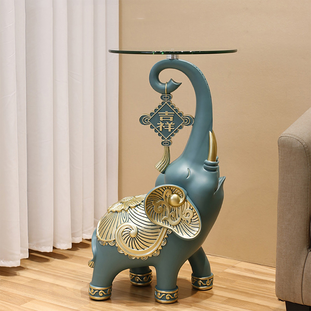 b416b6d8bbcd6ba611c19bc898160d45 The Resin Elephant Glass Top Coffee Table is a stunning fusion of art and functionality, designed to be the centerpiece of any room. Featuring a lifelike elephant base crafted from premium resin and topped with durable tempered glass, this table adds a touch of elegance and creativity to your space. Available in two sizes, it serves as both a functional coffee table and a stylish storage solution. Perfect for living rooms, commercial spaces, or eclectic décor themes, this semi-handmade table is not just furniture—it's a conversation starter and a true work of art. Elevate your space with this unique and captivating piece!