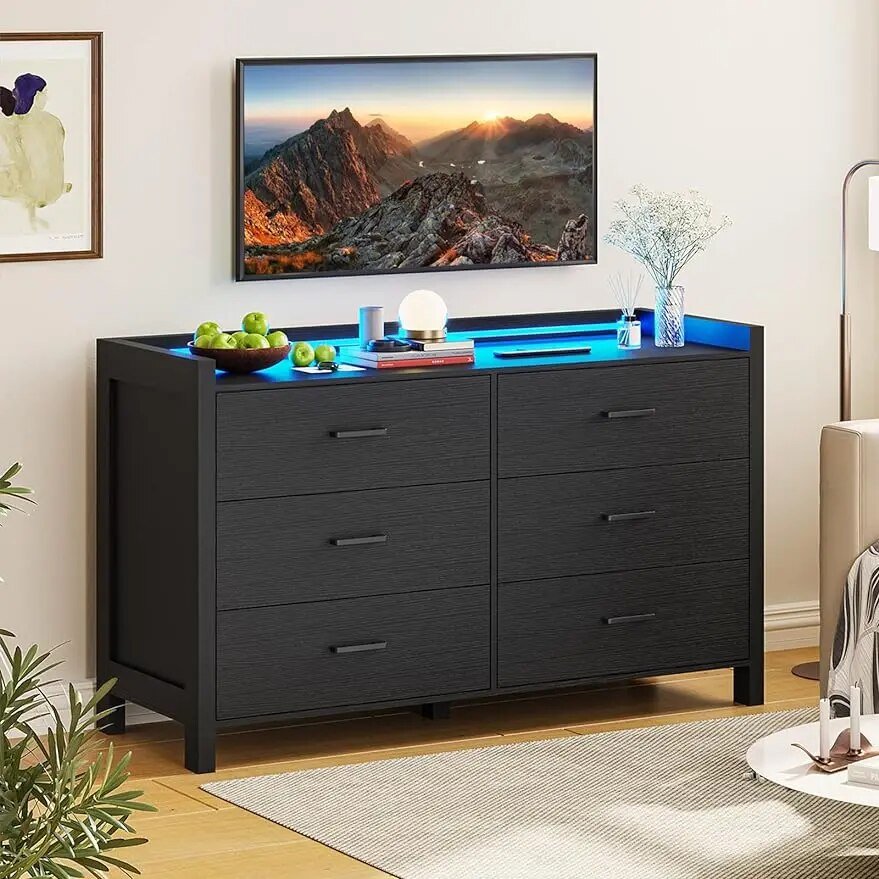 Elevate your space with the Modern LED 6-Drawer Dresser, where style meets smart functionality. This sleek black dresser features customizable LED lighting with over 60,000 color options and dynamic effects, all controlled via app or remote. Crafted from high-quality engineered wood, it offers durability and ample storage with six spacious drawers and a large tabletop. Perfect for bedrooms, living rooms, or nurseries, its modern design enhances any room while keeping your space organized. With easy installation and safety features, this dresser transforms both your décor and daily routine.