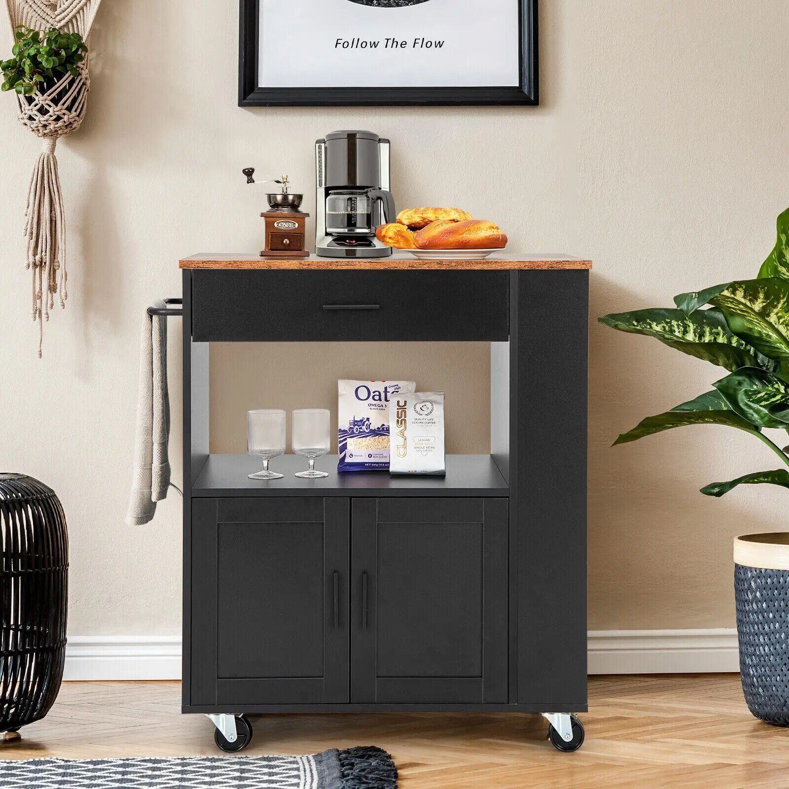 ee47e3bf4290478185fc582f651c333f.jpg-full Introducing the Modern Rolling Kitchen Island Cart – the perfect combination of style, convenience, and functionality for your kitchen. Crafted from sturdy engineered wood and iron, this sleek black cart features multiple storage options, including a convenient drawer and 3 built-in spice racks. Its smooth-rolling wheels make it easy to move and reposition, while lockable wheels ensure stability when stationary. Whether you're preparing meals, storing essentials, or serving guests, this versatile cart provides the perfect blend of workspace and storage. Upgrade your kitchen today with this stylish and practical addition!