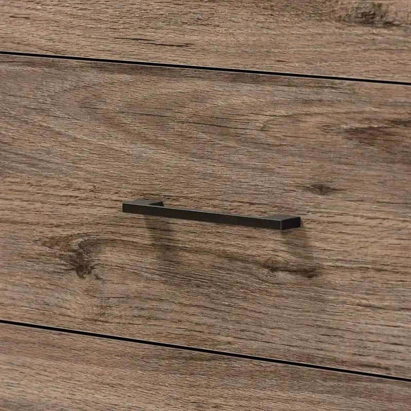 0448a96ec4cfe4e4868b61b2f6e121dd.jpg-full Introducing the Rustic Oak 4-Drawer Storage Chest—the perfect blend of modern design and rustic charm. Crafted from high-quality engineered wood with a sturdy metal base, this chest offers four spacious drawers to store clothes, linens, and more. Its sleek metal handles complement the warm oak finish, adding elegance to any bedroom. Easy to assemble and made with premium craftsmanship, this storage chest combines style and utility to keep your space organized. Elevate your home with this timeless, functional piece today!