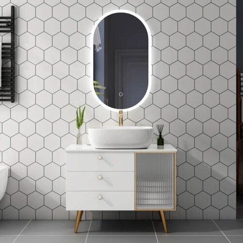 Transform your bathroom with the Modern White Oak Bathroom Vanity Set, a stunning combination of elegance and practicality. Crafted from premium oak with a sleek white finish, this set features a luxurious marble countertop and an illuminated mirror for a modern touch. Designed to simplify your bathroom upgrade, this vanity set provides everything you need in one complete package. Its timeless design complements any contemporary decor, making it the perfect choice for both busy mornings and relaxing evenings. Elevate your space with this blend of style, durability, and functionality—order yours today!