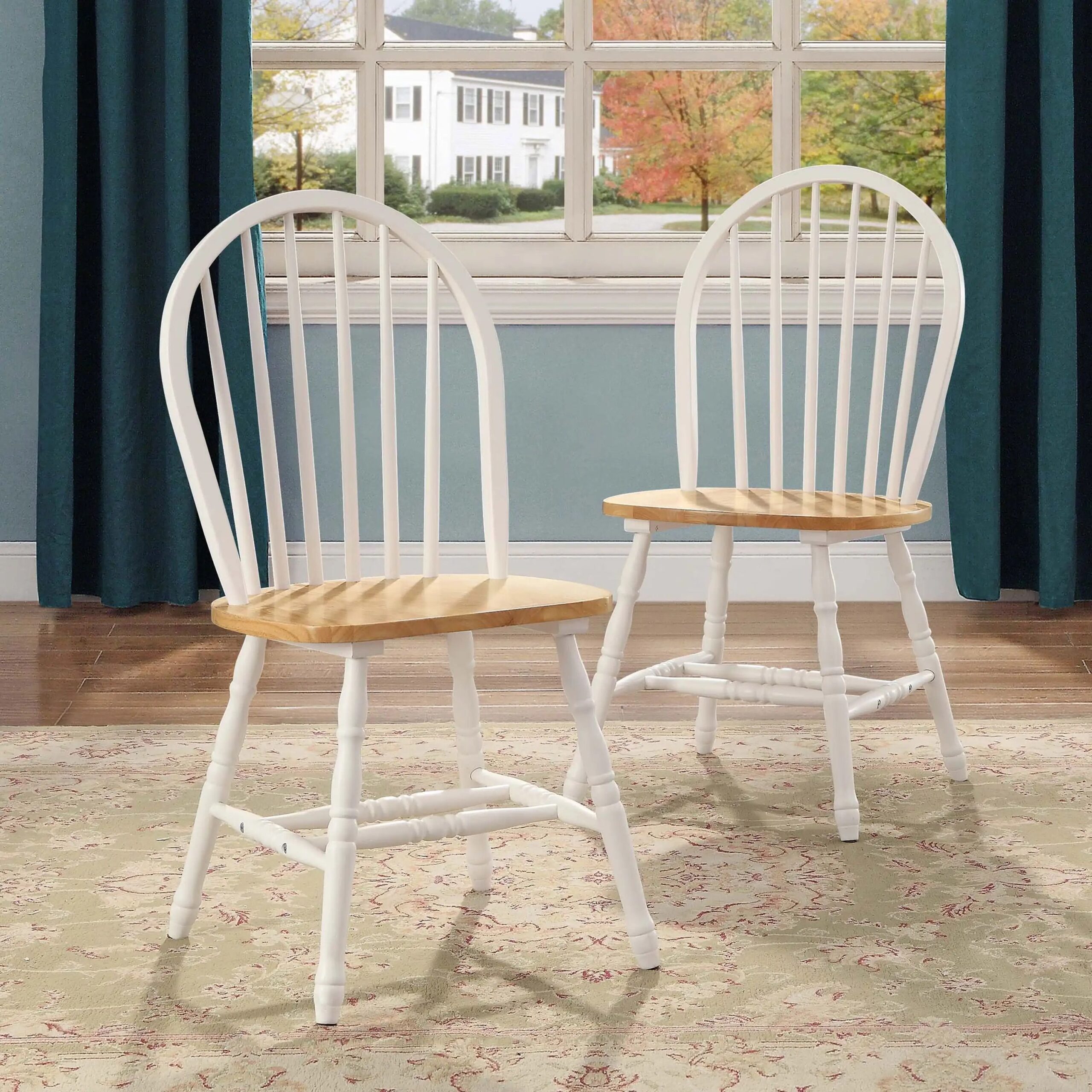 1da89832b4b40f74f4d593e5b21b642e.jpg-full Elevate your dining space with the Autumn Lane Windsor Dining Chairs. Crafted from solid wood with a charming White and Oak finish, these chairs combine classic farmhouse elegance with modern durability. Featuring stylish turned-wood legs and back, they offer both beauty and sturdy support. Ideal for any room—dining room, kitchen, or breakfast nook—these chairs complement a variety of interior styles and coordinate perfectly with the Autumn Lane Dining Table. Easy to assemble and built to last, they’re the perfect addition to create a warm, inviting dining atmosphere.