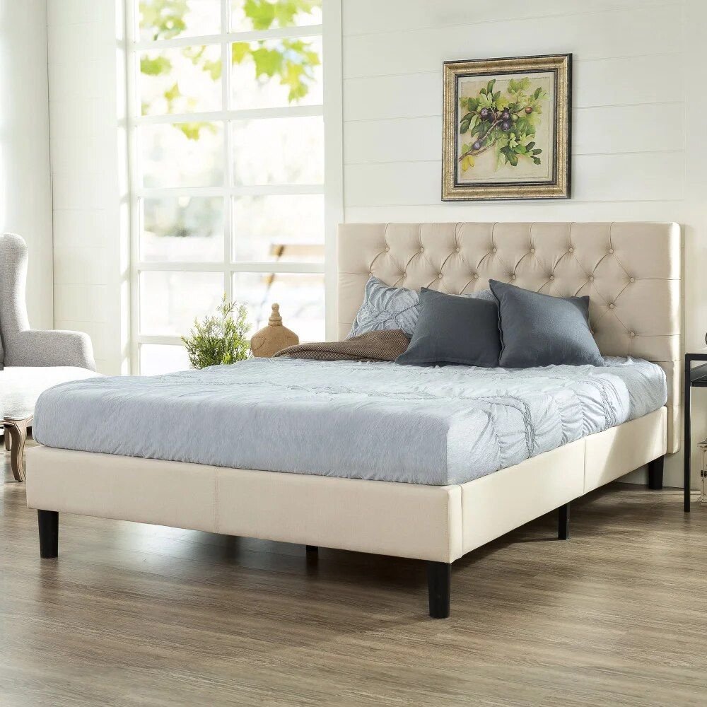 20a691e940c7ef52614f9db7c81310ff.jpg-full Transform your bedroom into a luxurious retreat with the King-Sized Upholstered Platform Bed Frame. Featuring a timeless button-tufted design and a robust steel framework, this bed offers both elegance and durability. The wooden slat system eliminates the need for a box spring, providing excellent mattress support. With a 700 lb weight capacity and easy two-person assembly, this bed is designed for both comfort and longevity. Available in neutral shades, it seamlessly fits into any decor. Mattress and box spring not included.