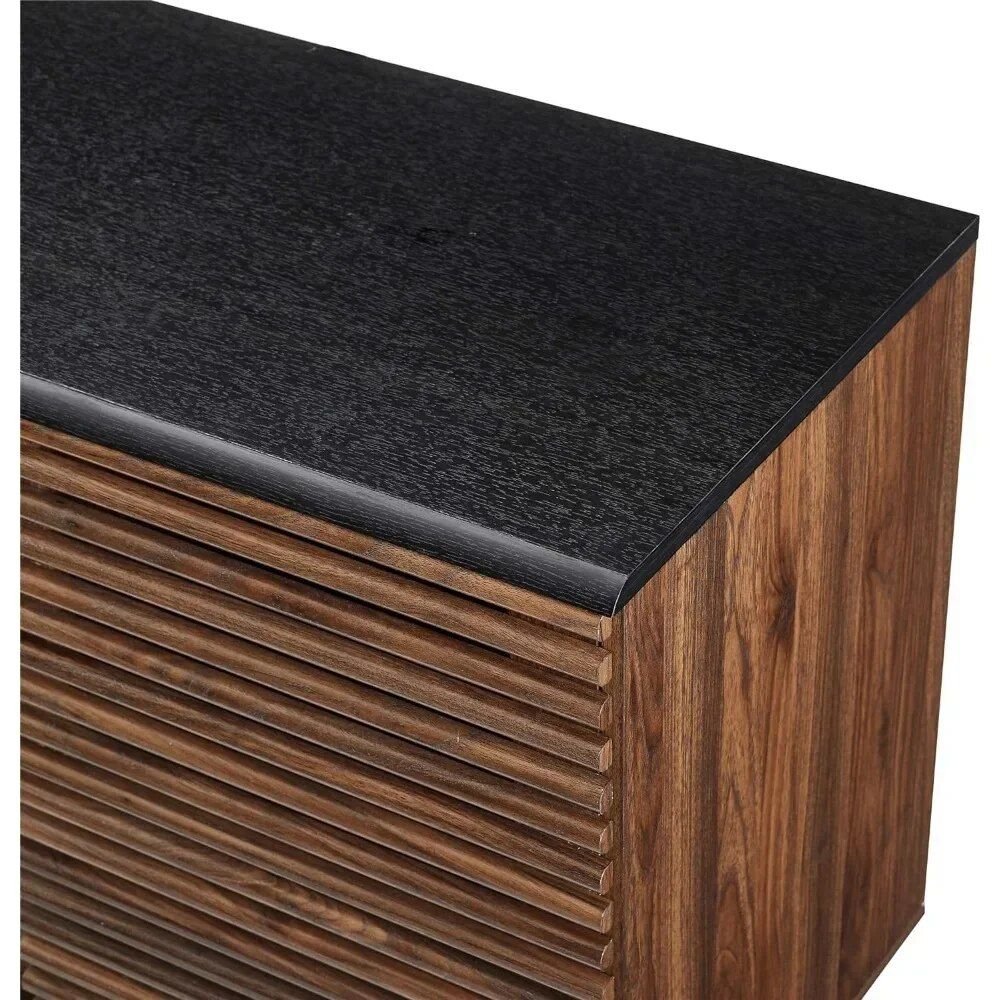 3b51973e1c92a2b9cad28a8d2215238e.jpg-full Introducing our Sophisticated Storage Cabinet—a perfect blend of style and functionality to elevate any room in your home. Crafted from high-grade MDF with durable laminate, this modern cabinet features five spacious drawers, two sliding slat doors, and adjustable shelves for versatile storage. Ideal as a TV stand for screens up to 65