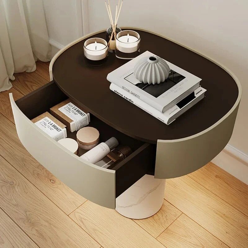3d5c4a687dd178af8435474c7f2d2108.jpg-full Elevate your bedroom with our Modern Moroccan Minimalist Nightstand, a sophisticated blend of contemporary design and functional elegance. Featuring clean lines, a Moroccan-inspired aesthetic, and dual drawers for organized storage, this nightstand brings both style and practicality to any room. Crafted from sturdy wood for durability, its no-roller design ensures stability and a sleek look. Perfect for any décor, from modern to traditional, this versatile piece offers hassle-free assembly and free shipping options. Transform your bedroom into a stylish, clutter-free sanctuary today!