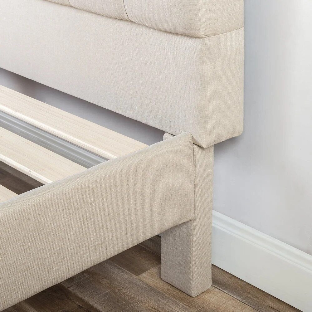 4a6fe8de45733621ca1d9415bfd92724.jpg-full Transform your bedroom into a luxurious retreat with the King-Sized Upholstered Platform Bed Frame. Featuring a timeless button-tufted design and a robust steel framework, this bed offers both elegance and durability. The wooden slat system eliminates the need for a box spring, providing excellent mattress support. With a 700 lb weight capacity and easy two-person assembly, this bed is designed for both comfort and longevity. Available in neutral shades, it seamlessly fits into any decor. Mattress and box spring not included.