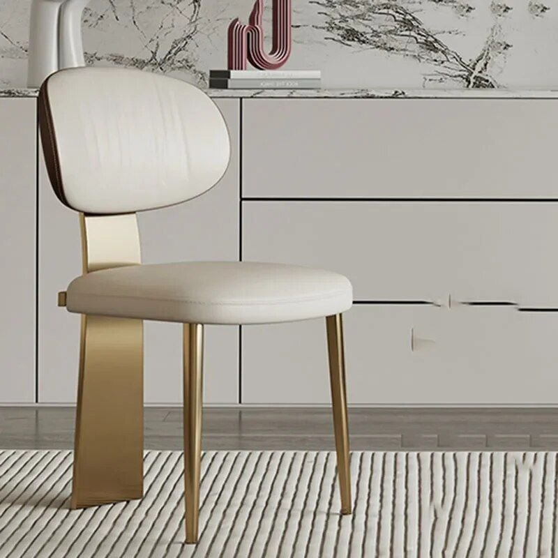 8e4f9afe6863ed6e467aec637caf5163.jpg-full Elevate your space with the Luxury Minimalist Modern Dining Chair, a perfect blend of elegance and functionality. Designed with a sleek armless profile, this chair complements any contemporary décor while offering comfort and practicality. Crafted with sturdy metal construction, it ensures durability for both indoor and outdoor use. Ideal for dining rooms, kitchens, balconies, or salons, its minimalist style and foldable design make it versatile and easy to store. Add a touch of modern luxury to your home—this chair is the perfect choice for any sophisticated setting.