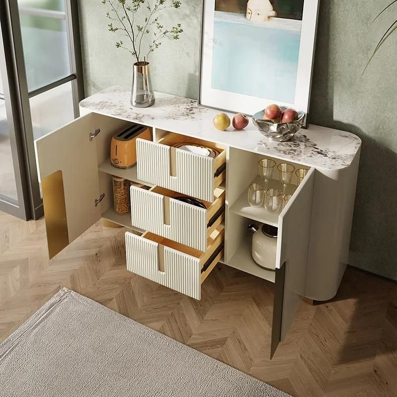 92c15d29e4806b4bb0c722101a2635d5.jpeg-full Enhance your home with the Elegant Slate Top Sideboard, a perfect blend of modern design and practical functionality. Featuring sleek, minimalist lines and a durable slate top, this sideboard offers generous storage while adding a sophisticated touch to any room. Crafted with eco-friendly, non-polluting materials and rounded corners for safety, it’s ideal for living rooms, kitchens, or entrance halls. The versatile design complements any decor, making it a stylish, functional addition to your home.