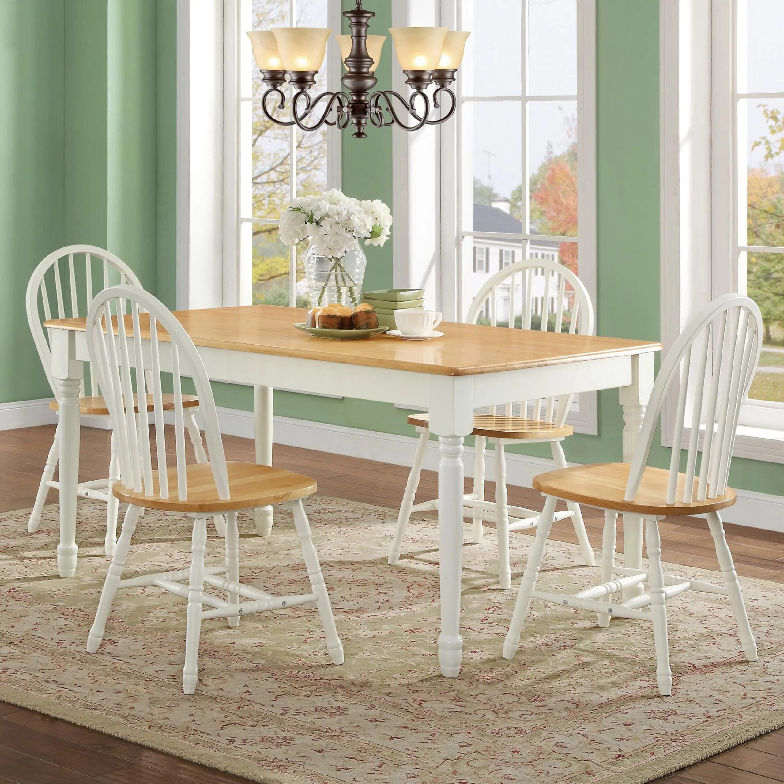 9723d259b4ff712370fec4b776357b34.jpg-full Elevate your dining space with the Autumn Lane Windsor Dining Chairs. Crafted from solid wood with a charming White and Oak finish, these chairs combine classic farmhouse elegance with modern durability. Featuring stylish turned-wood legs and back, they offer both beauty and sturdy support. Ideal for any room—dining room, kitchen, or breakfast nook—these chairs complement a variety of interior styles and coordinate perfectly with the Autumn Lane Dining Table. Easy to assemble and built to last, they’re the perfect addition to create a warm, inviting dining atmosphere.