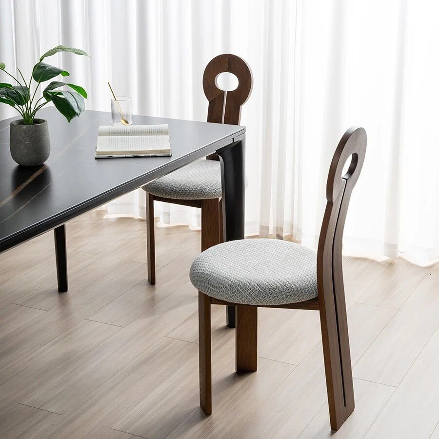 d10cc51f566c2b96859b7cb9b03c2f9c.jpg-full Discover Timeless Elegance & Comfort with the Modern Minimalist Solid Wood Dining & Lounge Chair. Crafted from high-quality solid wood, this chair combines durability with a sleek, minimalist design that enhances any space. Ideal for dining, lounging, or creating a stylish reading nook, it offers ergonomic comfort without handrails. No assembly required, it’s ready to use right out of the box. Whether in your dining room, living room, or home office, this versatile chair is a statement piece that adds sophistication to your home. Order now and elevate your space with elegance and comfort.